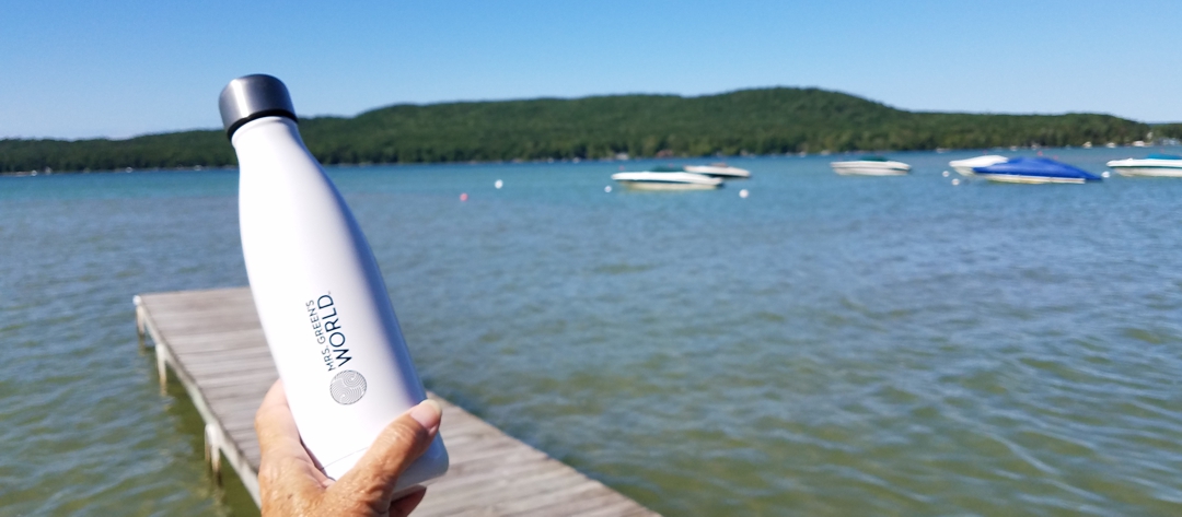 Mrs. Green's World S'well bottle with lake in background