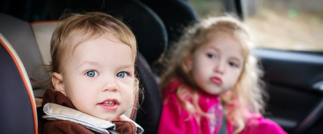 two children in car seats