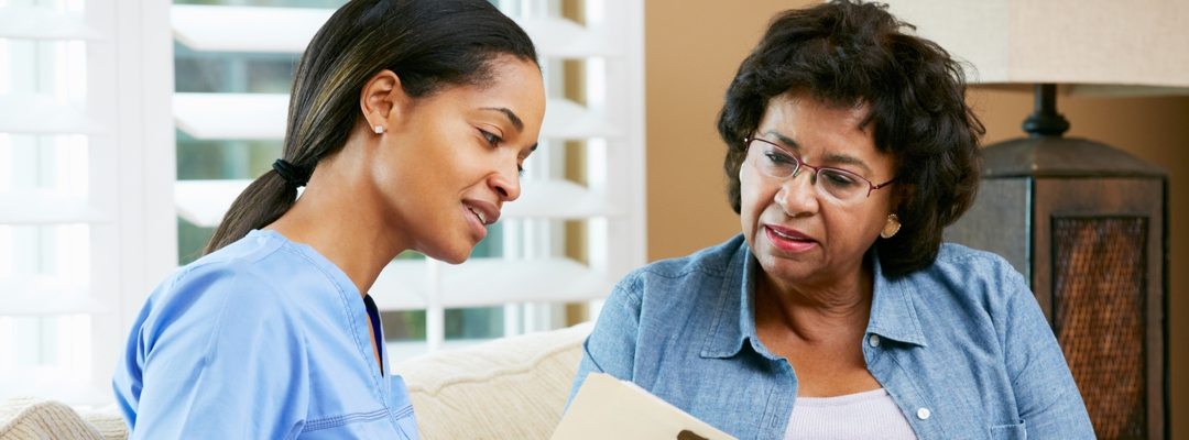 Two women discussing health plan