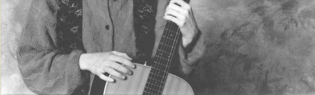 Roderick holding her guitar