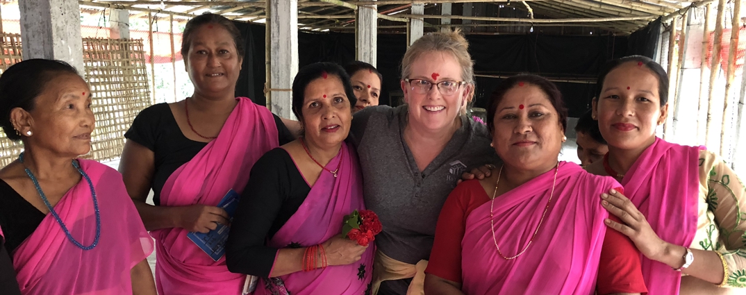 group of women in Nepal wearing pink saris