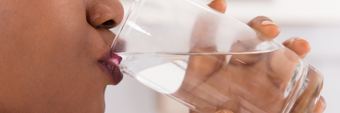 woman drinking glass of water