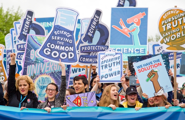 Youth carrying signs about preservation of the planet