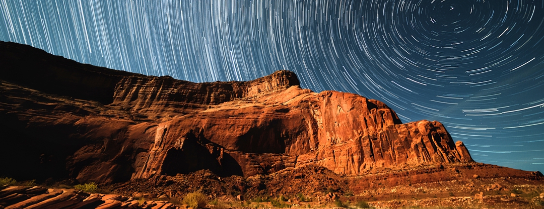 Arizona mountain with swirling sky at sunset