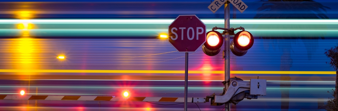 flashing light at night at railroad track