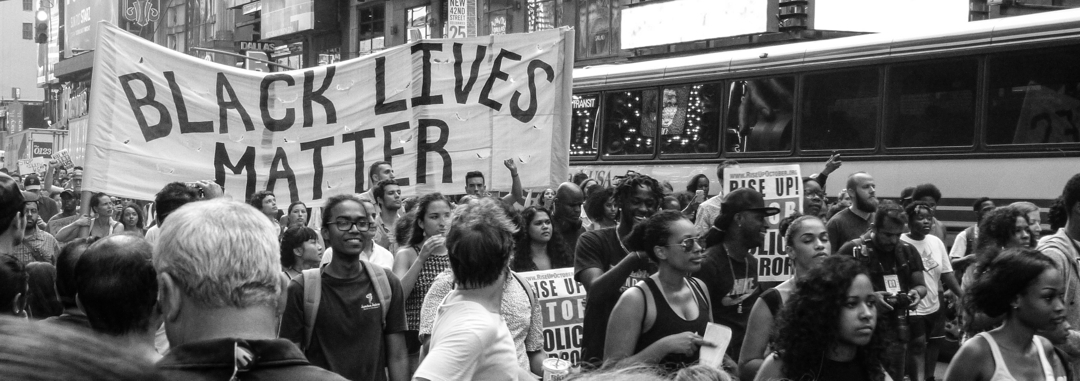 Black lives matter rally carrying signs and marching