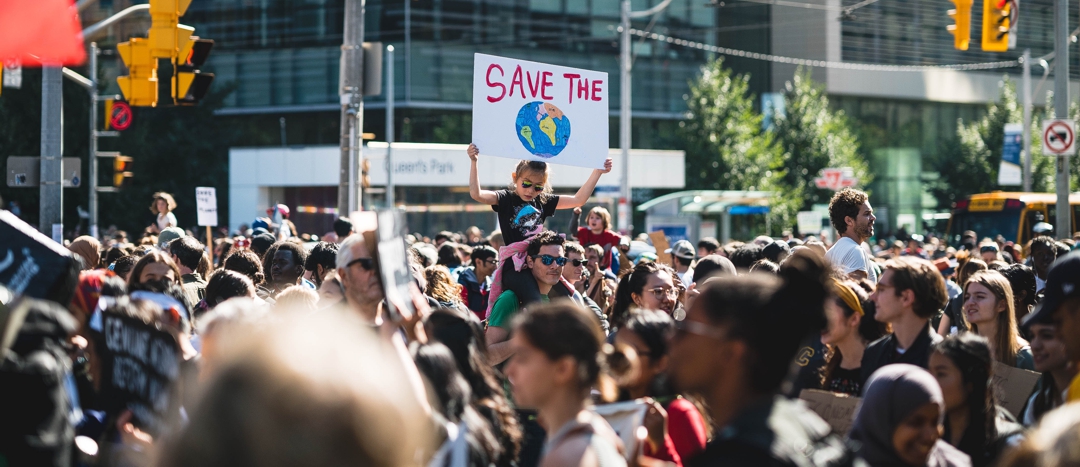 city street scene: group of youth rallying for climate change