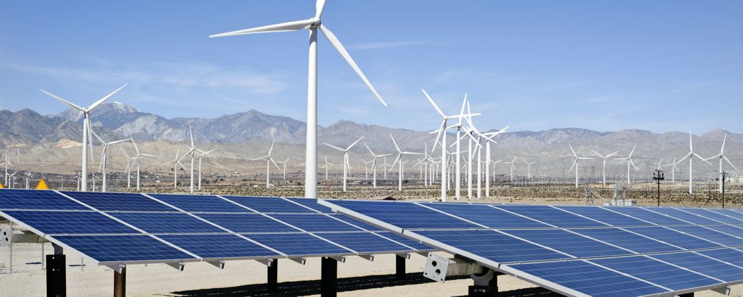 Wind turbines and solar panels in the desert