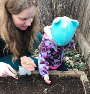 Amy and Rosie planting seeds