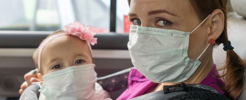 mother and child wearing protective mask to fend off Covid-19