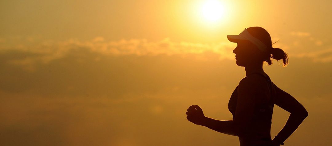 woman jogging in early morning light