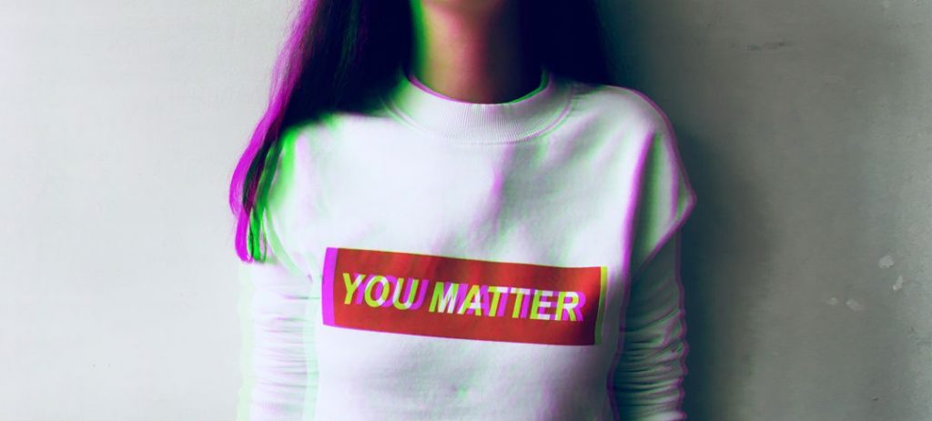 young woman wearing T-shirt that says "you matter"