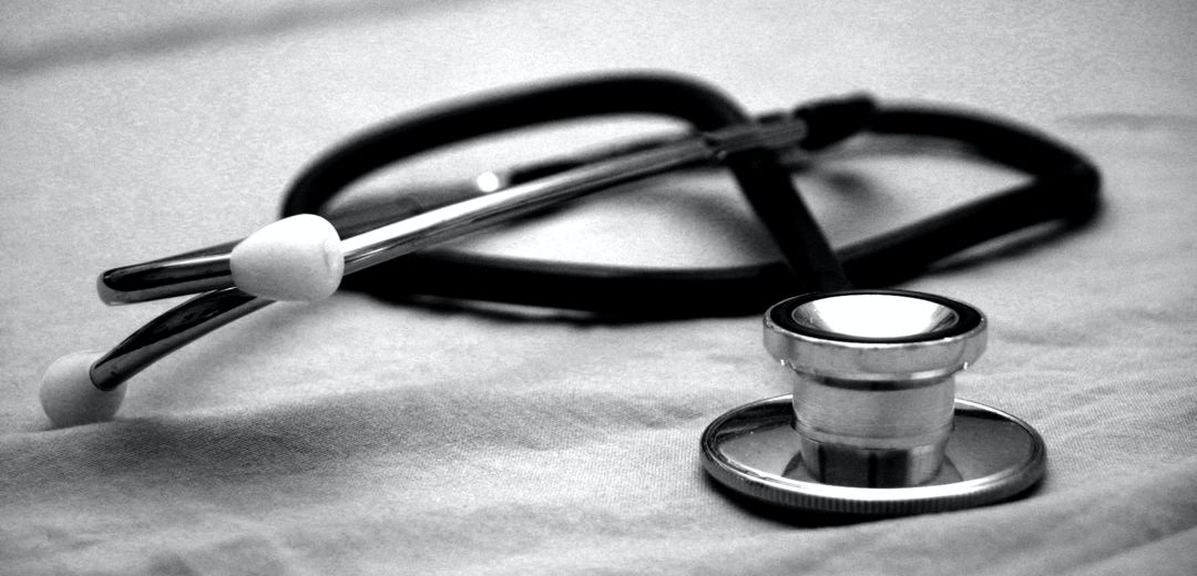 black and white photo of stethoscope