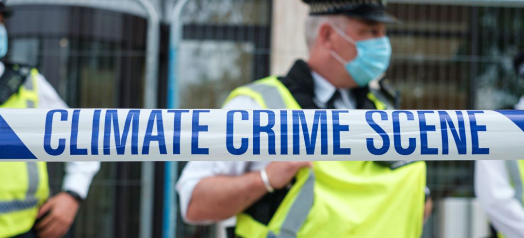 climate crime scene banner with officers in background