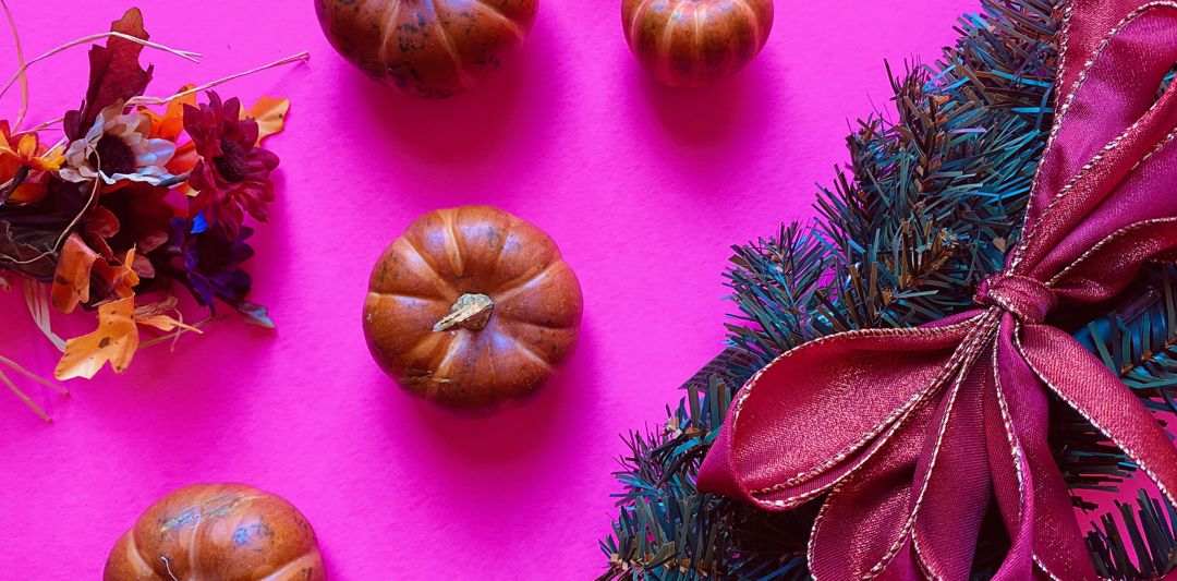 Christmas wreath and small pumpkins