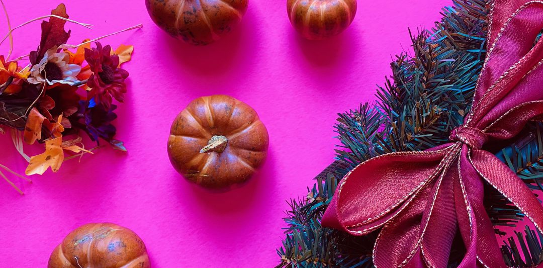 Christmas wreath and small pumpkins