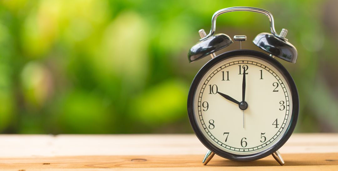 Clock sitting on window ledge